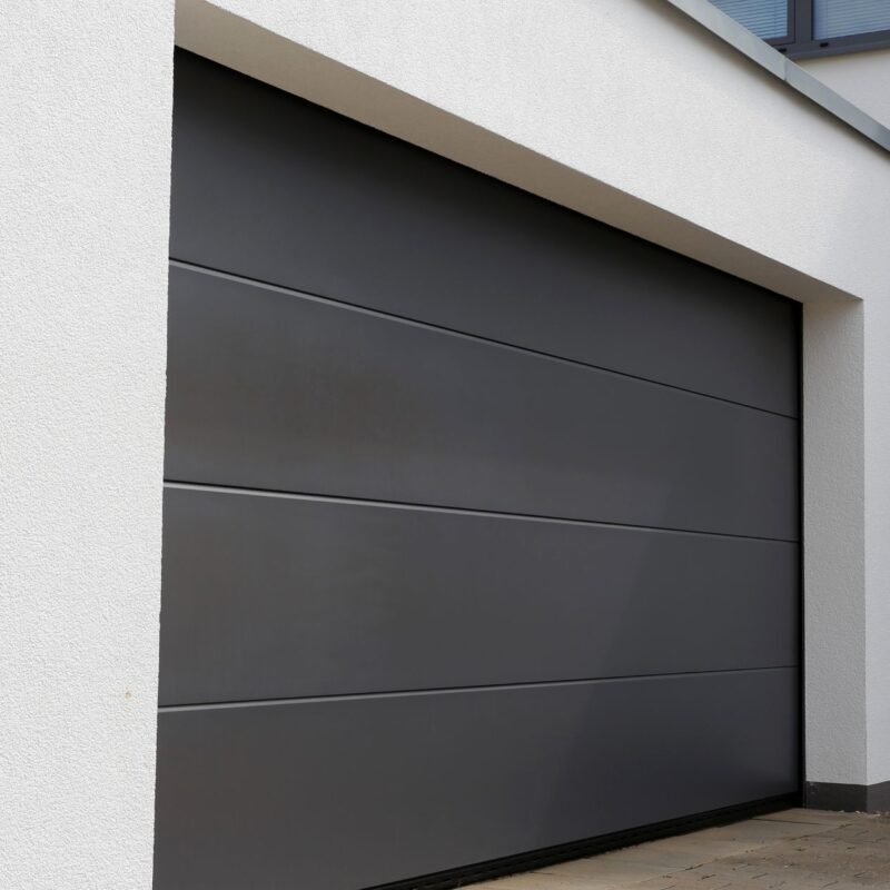 Garage door maintenance inspection by The Garage Door Authority technician