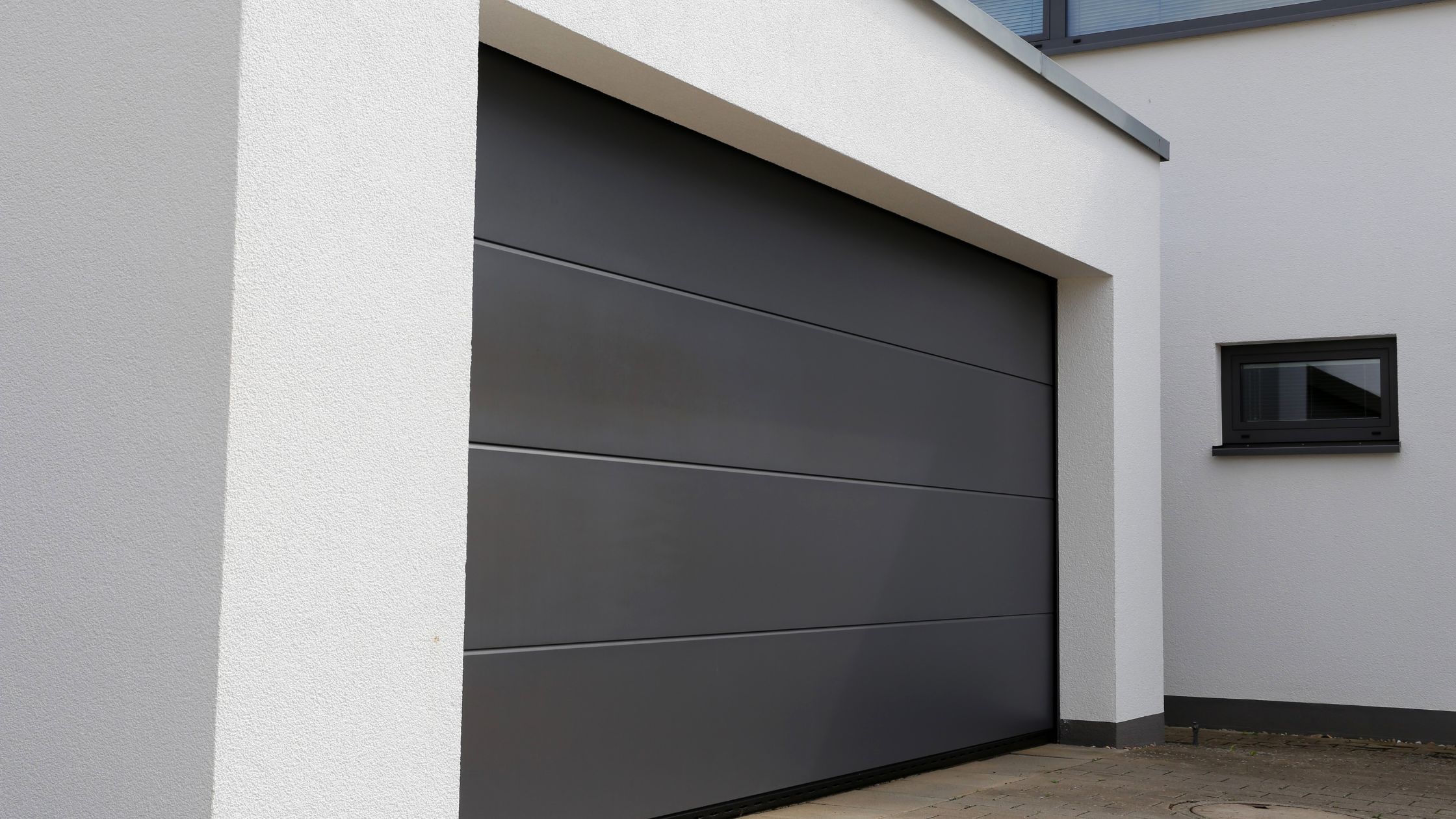 Garage door maintenance inspection by The Garage Door Authority technician