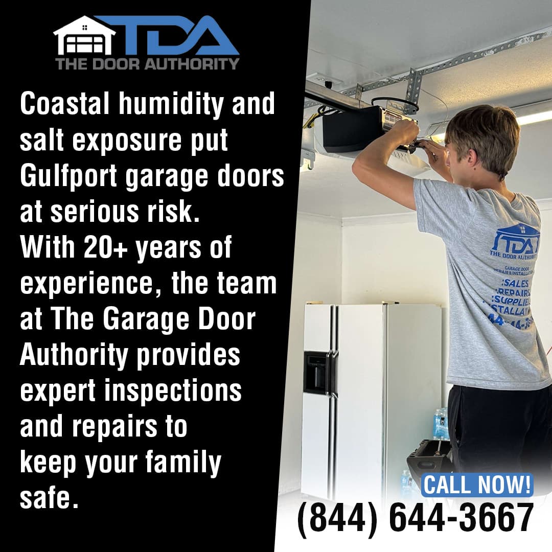 A technician from The Garage Door Authority repairs a garage door opener inside a residential garage, standing on a ladder near the ceiling while working with tools.