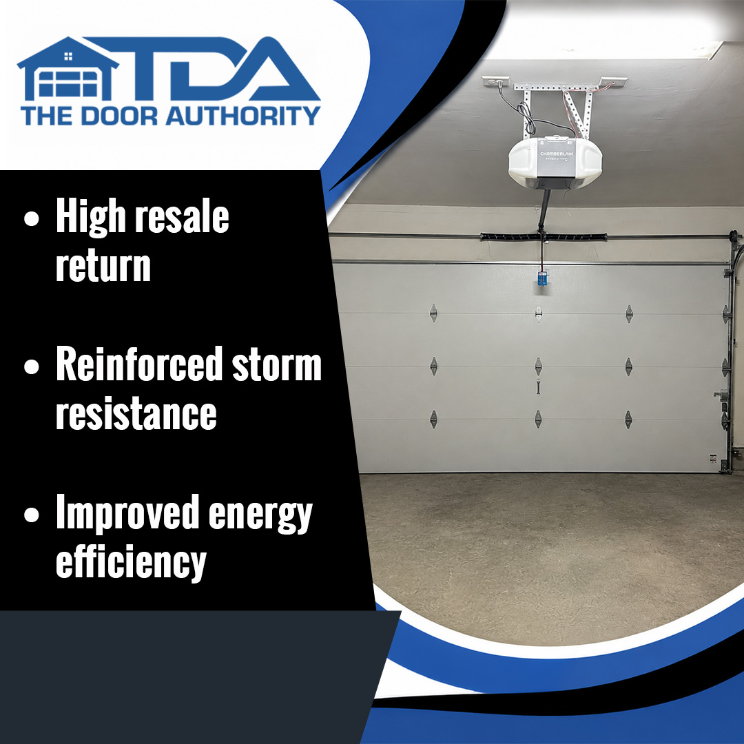 Interior view of an installed white residential overhead garage door connected to a ceiling-mounted automatic door opener.